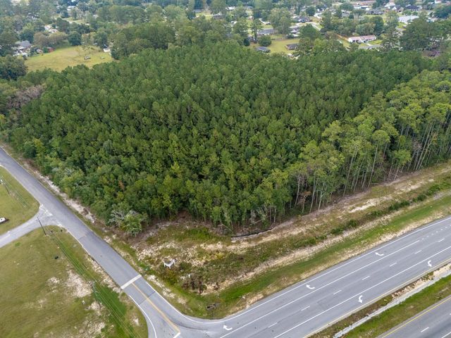 Aerial view looking east across GA Hwy 21 Bypass at the corner of the site and W First Street Extension, no boundary lines shown